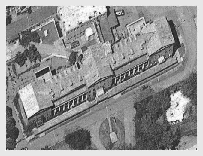 Figure 11.The former MHS hospital on Errington Street, Stapleton, Staten Island, New York, now abandoned, as seen from above. The eastward facing front of the hospital is visible in the lower part of the picture. Google satellite photograph, 2010.